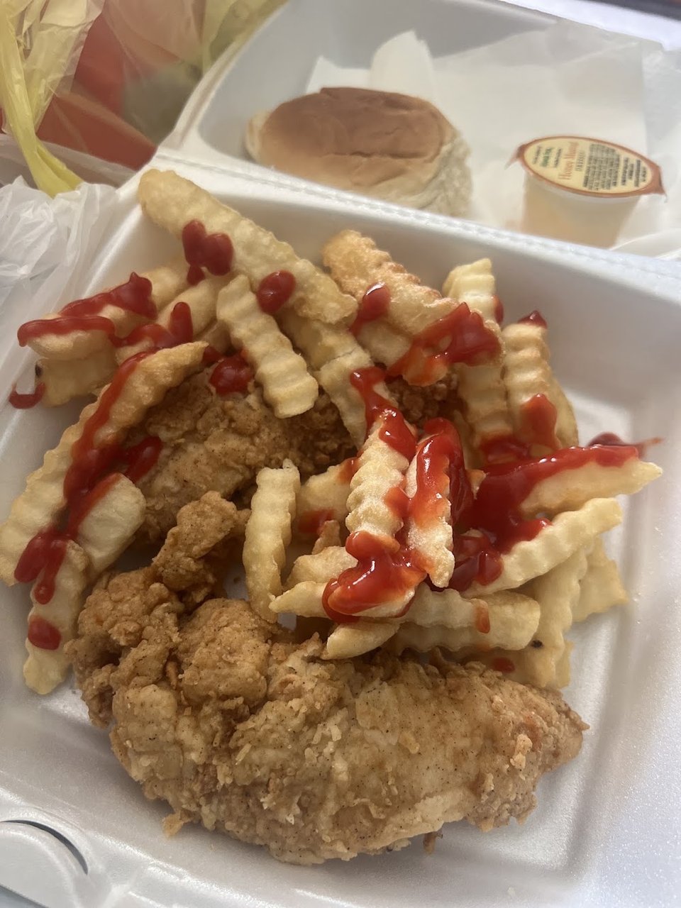 Chicken sandwich with fries and slaw.